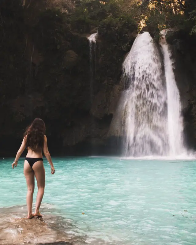 Kawasan Falls is one of the most iconic, photographed waterfalls in the Philippines, and if you love an adventure and have a knack for photography, you don’t want to miss this waterfall! While it can seem touristy from the media, I share in this full guide how you can maximize your time at these beautiful Kawasan waterfalls! #kawasanfalls #cebu #cebuisland #philippines
