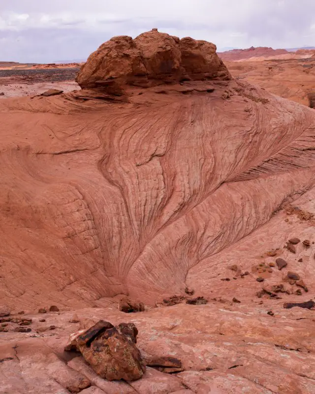 red rock formation marks the second portion of the Reflection Canyon trail where route-finding is required. the Navajo sandstone erodes downward into a bowl shape