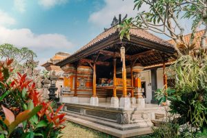 If you're wondering where to stay in Ubud, this guesthouse that looks like a temple should be a top choice. Vibrant green foliage encompasses an orange-hued pagoda. 