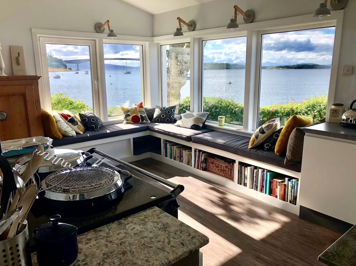 Cozy kitchen and window seat with harbor and Skye Bridge views, representing a great place to stay in Kyleakin, Isle of Skye.