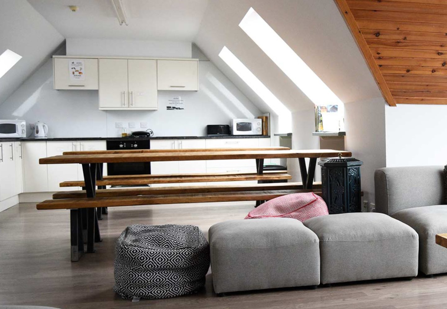 Interior of the shared self-catering kitchen and common area in the Old Inn Waterfront Bunkhouse, one of the best budget-friendly places to stay on the Isle of Skye.